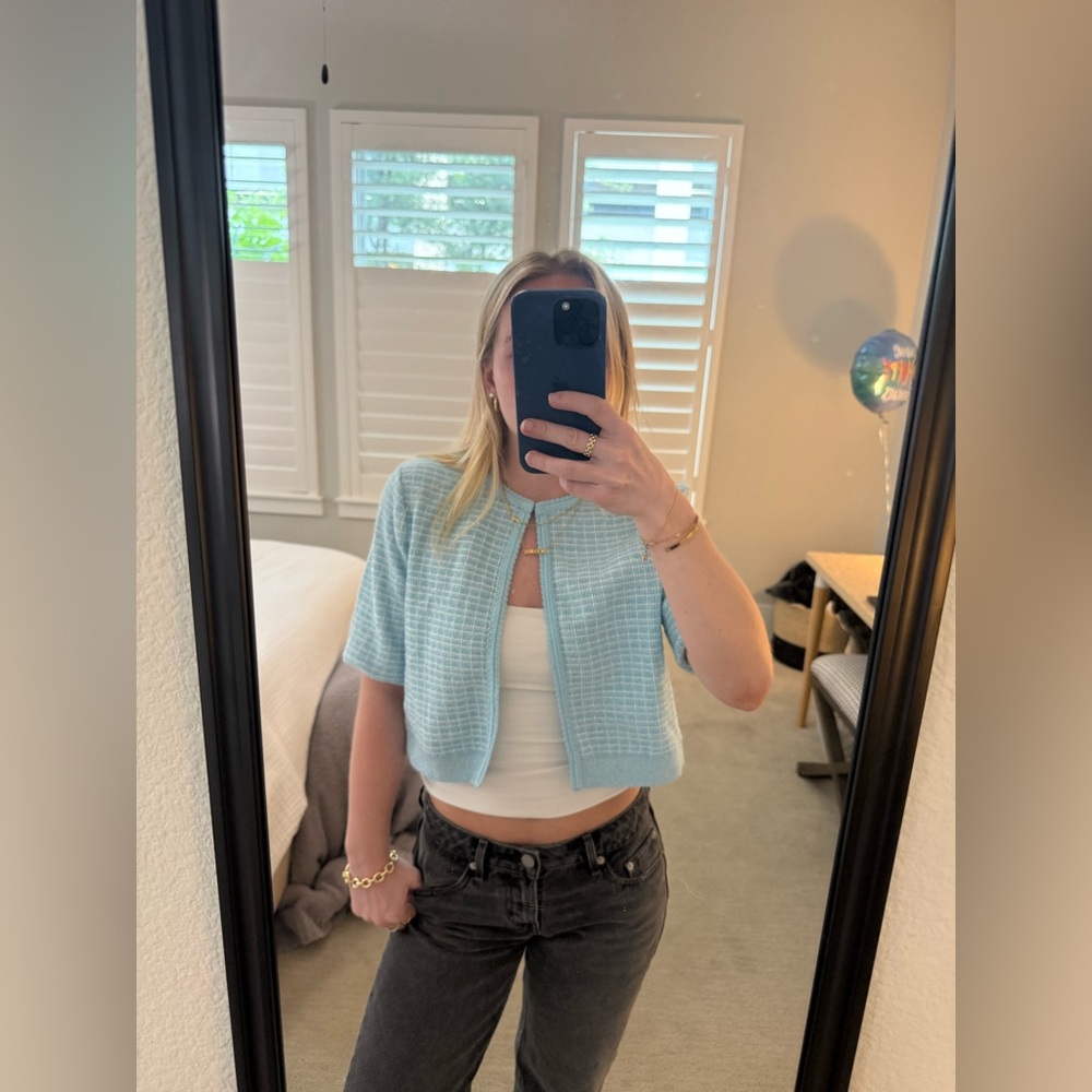 Light blue cropped short sleeve cardigan with button at the top